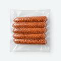 Four Beef Cheddar Smokies (Frozen) in a clear plastic vacuum-sealed package