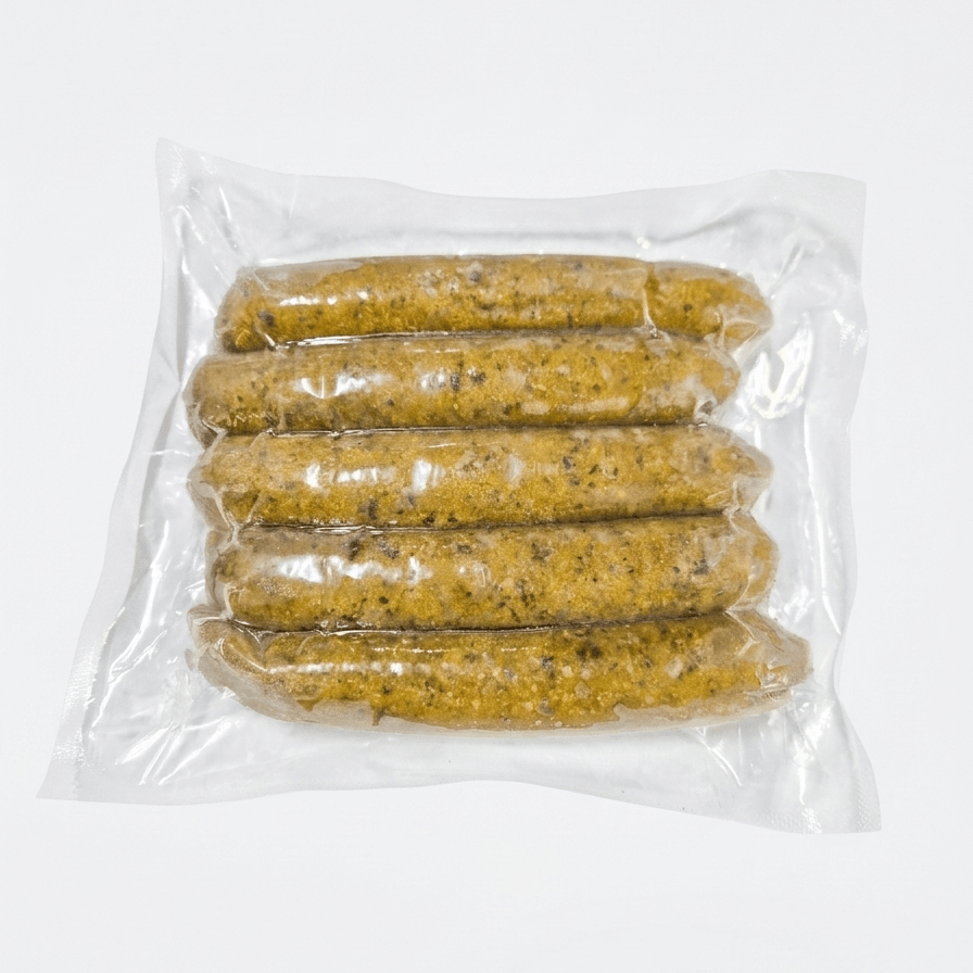 Five of Chicken Spinach Feta Smokies (Cooked / Frozen) in a clear plastic vacuum-sealed bag