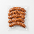 Five of Chorizo (Raw / Frozen) in a clear plastic vacuum-sealed bag