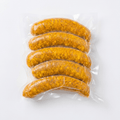 Five of Curry Bratwurst (Frozen) in a clear vacuum-sealed plastic bag