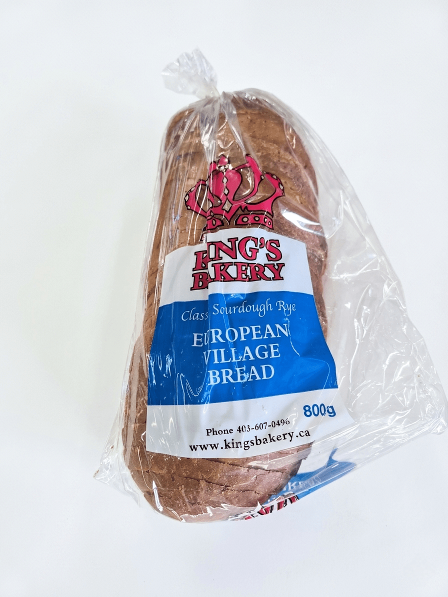A loaf of King's Bakery European Village Bread in clear plastic packaging with a blue, white, and red label