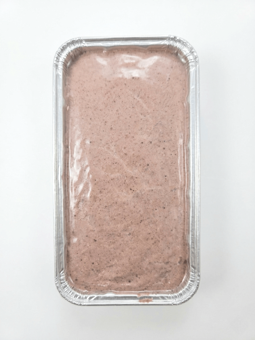 A rectangular aluminum foil pan filled with Fine Meatloaf (Raw / Frozen)