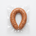 A Kolbassa ring (Frozen) vacuum-sealed in a clear plastic bag