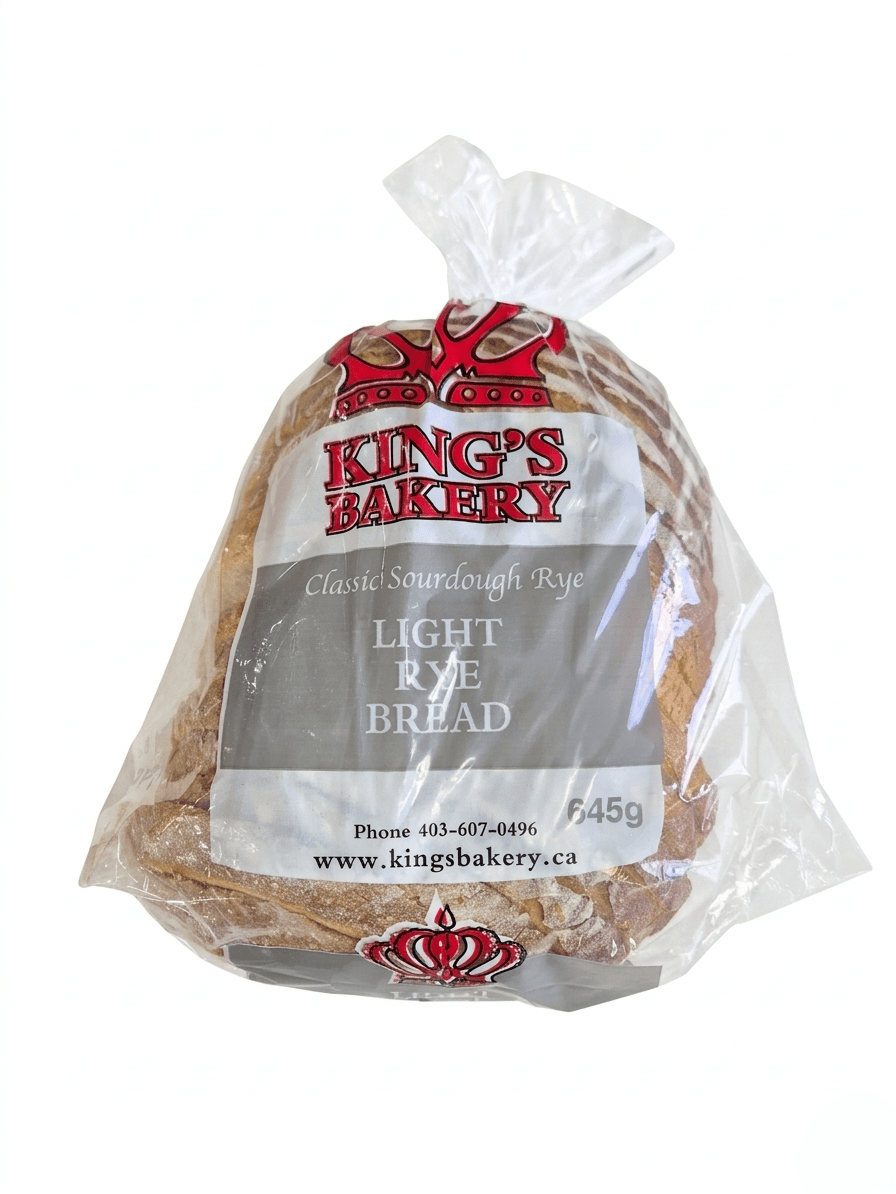 A bag of King's Bakery Classic Sourdough Rye Light Rye Bread, 645g, packaged in a clear plastic bag with a white and gray label and red crown logos.