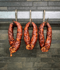 Three Mexican Twist hanging from metal hooks