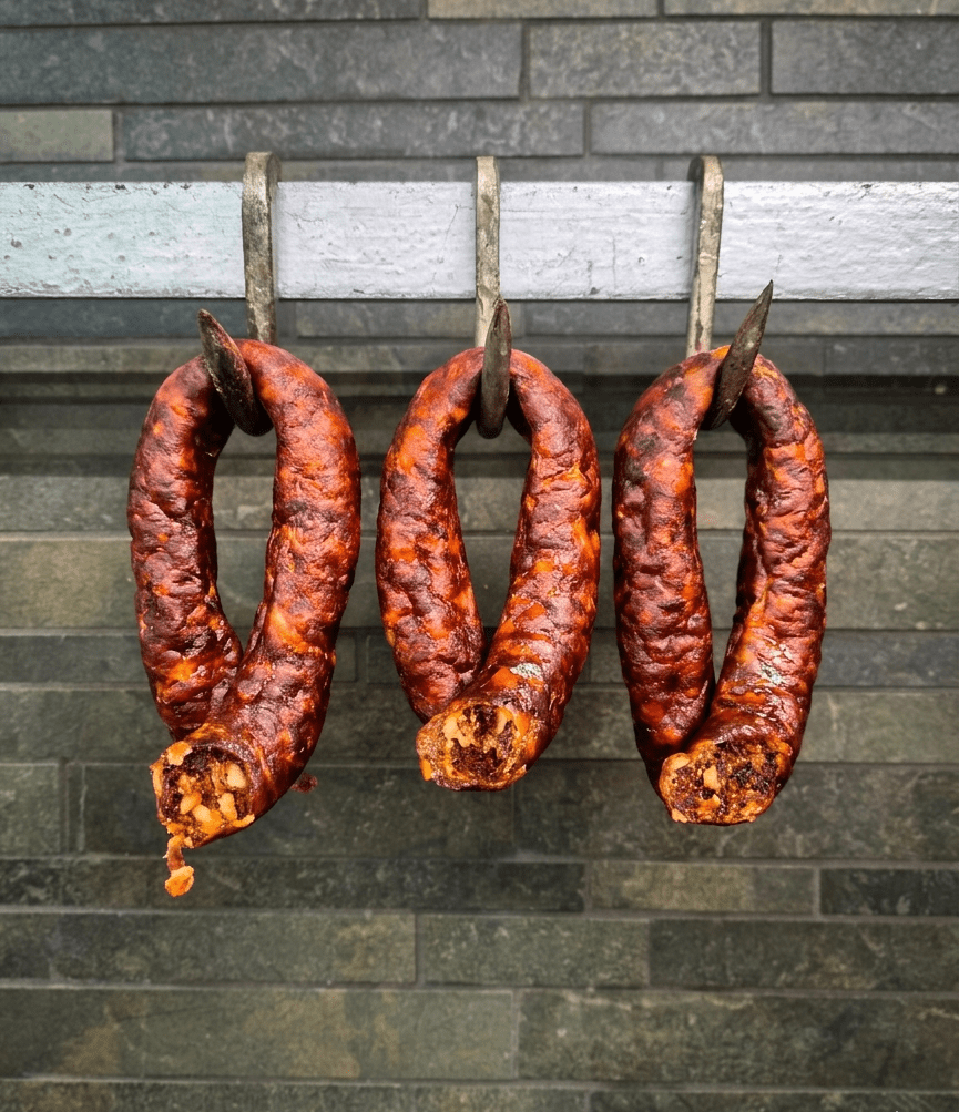 Three Mexican Twist hanging from metal hooks