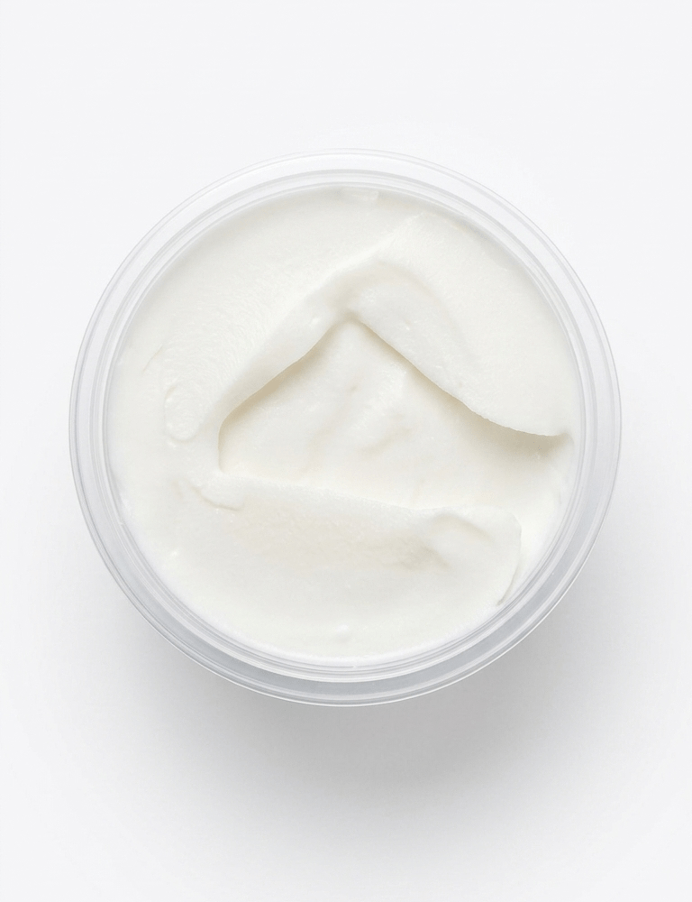 A top-down view of a clear plastic tub filled with Pork Lard