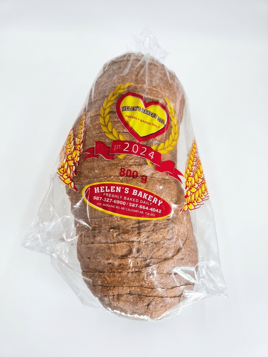 A sliced loaf of brown bread in clear plastic packaging with a red and yellow Helen's Bakery label