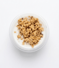 Top-down view of a clear plastic cup filled with Schmaltz