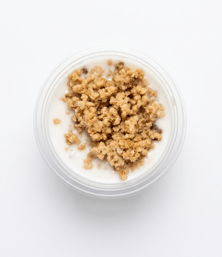 Top-down view of a clear plastic cup filled with Schmaltz