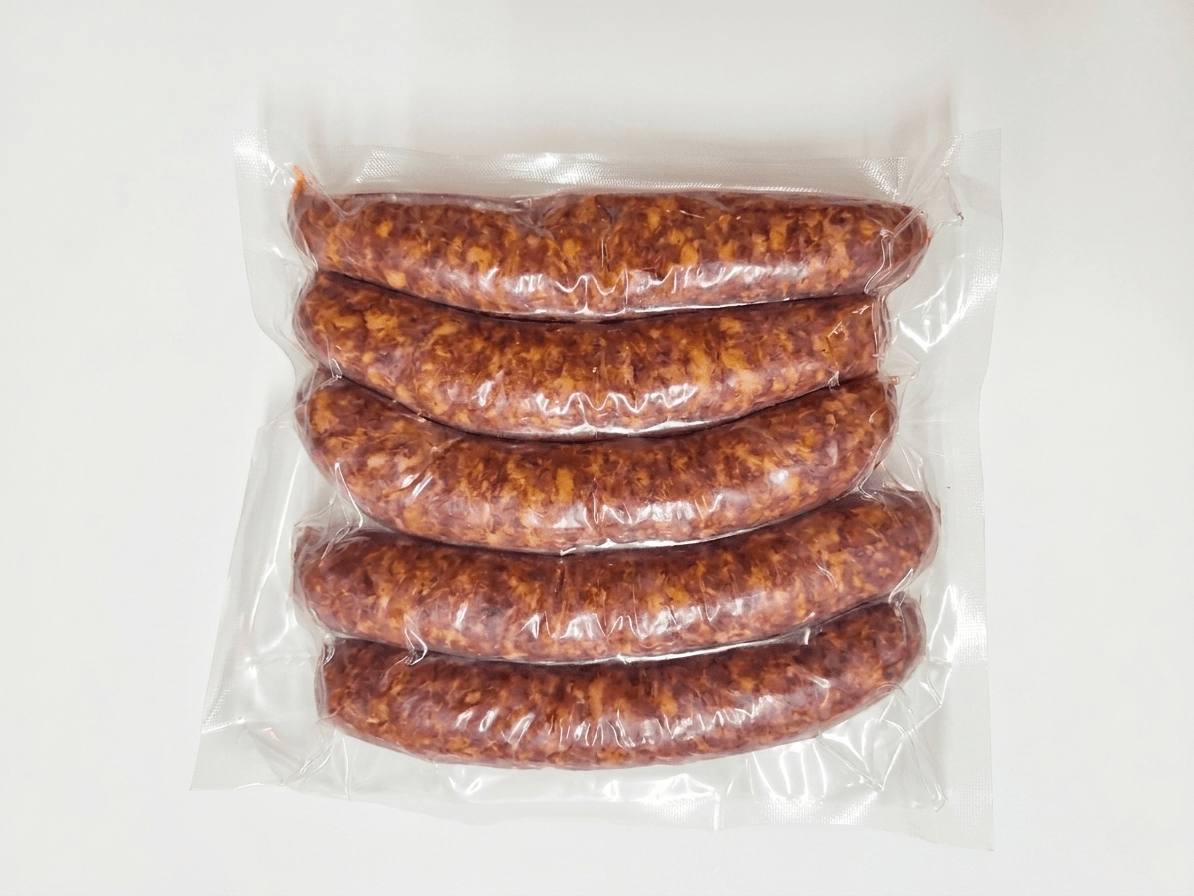 Five Westfalian Sausage in a clear plastic vacuum-sealed bag